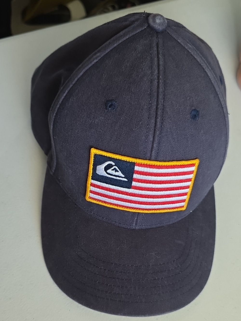 Quiksilver Kids Dark Blue Baseball Cap with Red & White Flag Patch